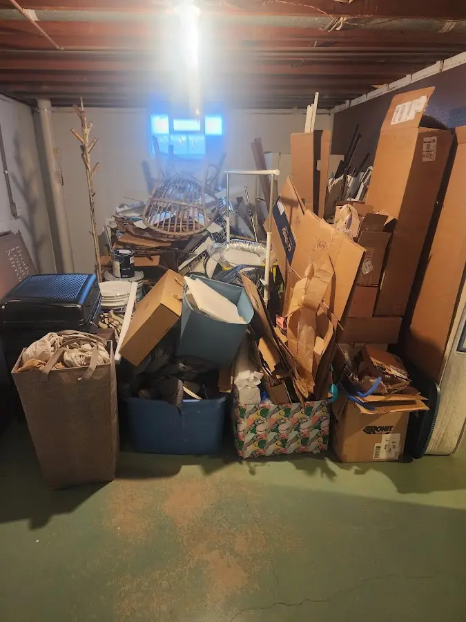 Roll-off dumpster container at job site for Yard Waste Dumpster Rental in Sussex