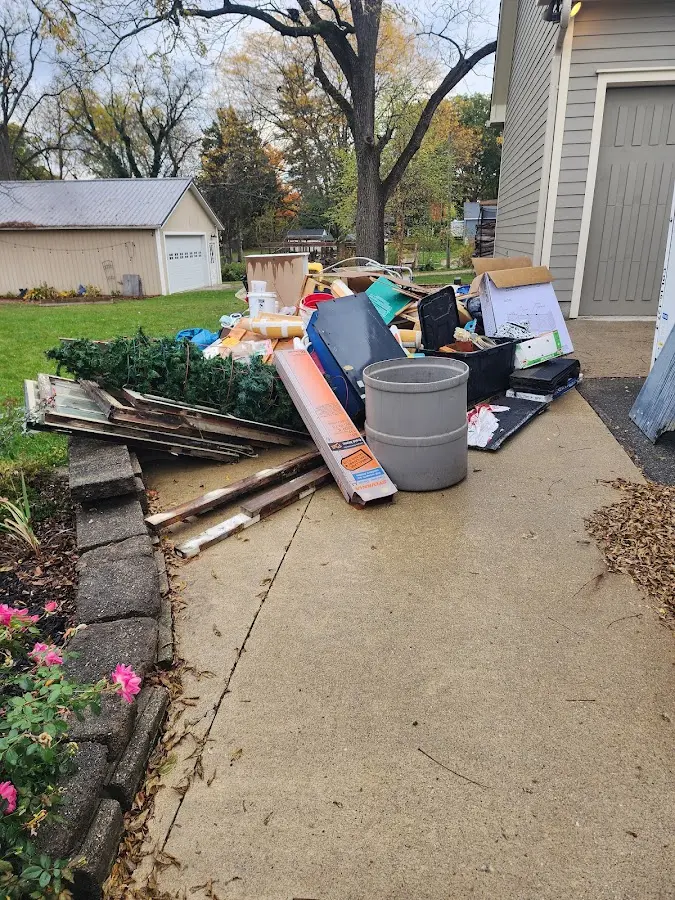 Dumpster being loaded with debris for 30 Yard Dumpster Rental in Sussex